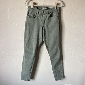 Green mid-rise skinny jeans